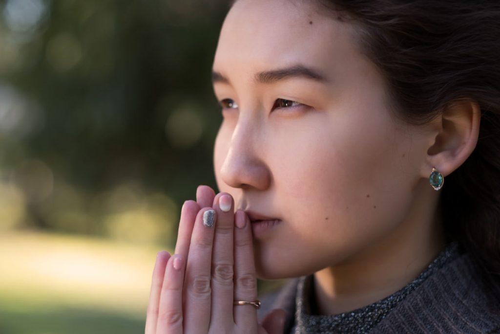 Lady praying, feminine energy