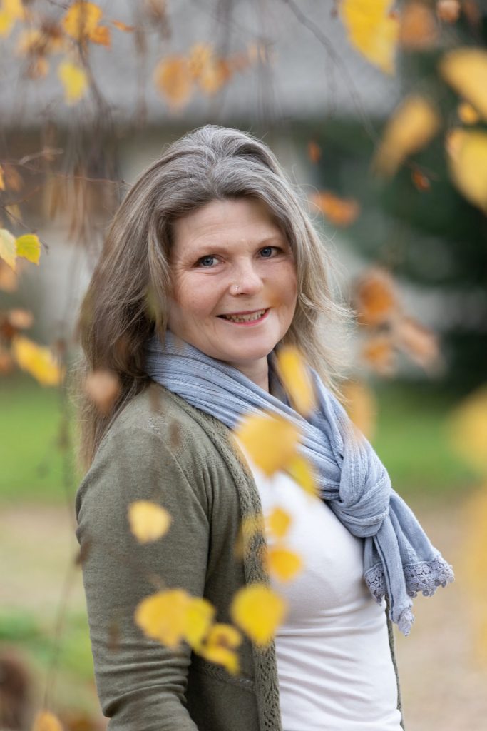 Catherine Rees, stood in a garden in nature