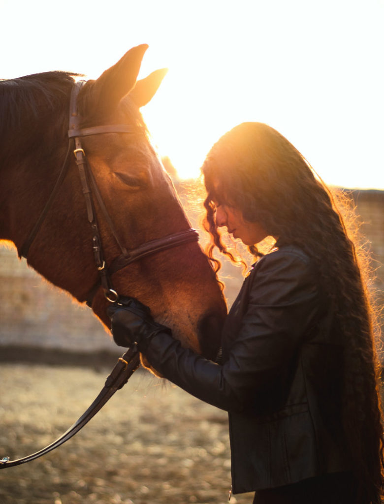 Lady connecting with her horse